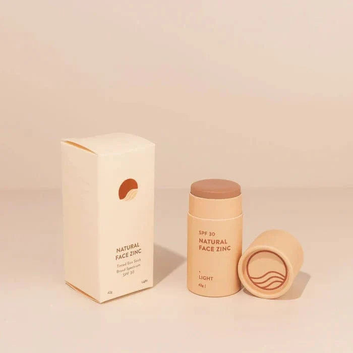 Natural face zinc product with packaging on a beige background